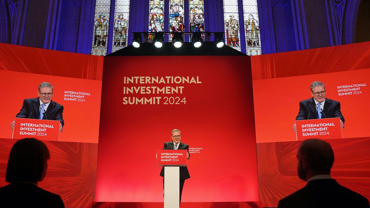 Britain's Prime Minister Keir Starmer delivers a speech on stage during the International Investment Summit.